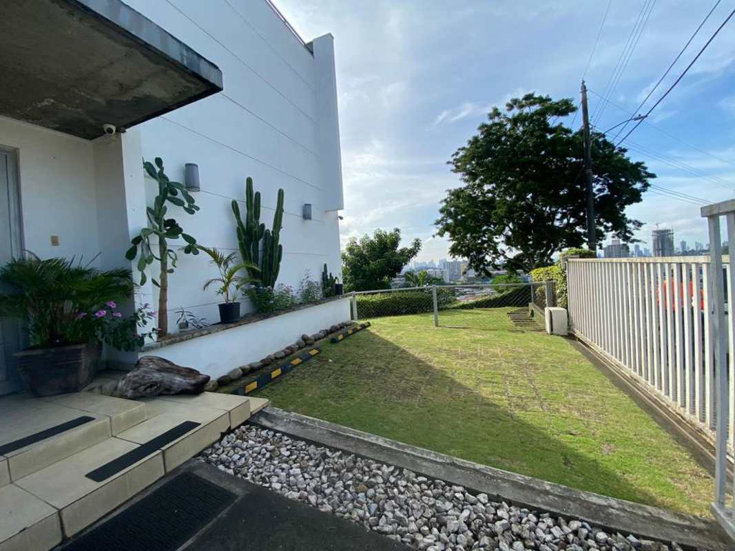 Landscaped garden with distant skyline view Linda Vista residence Panama City