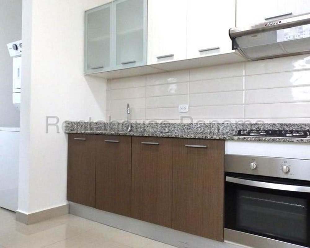 Modern kitchen with laundry hookups in PH Roma Tower San Francisco Panama