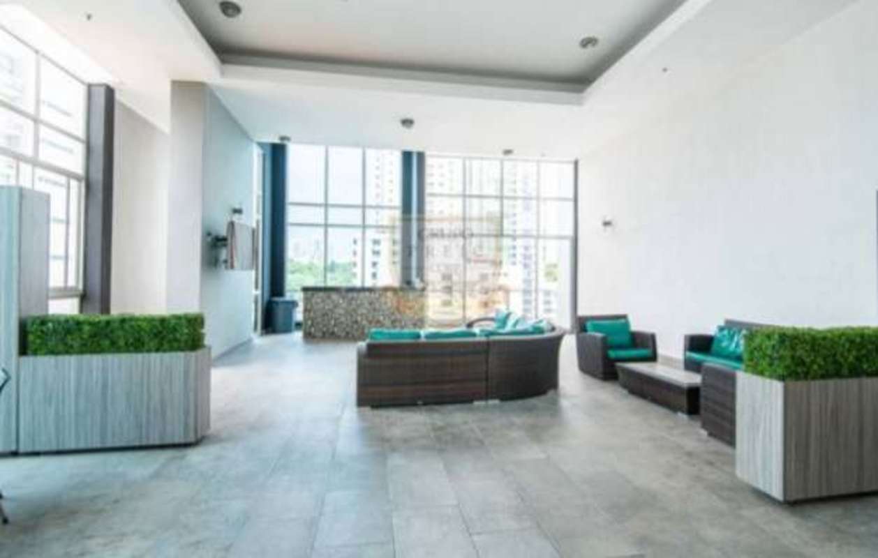 Rooftop sky lounge with floor to ceiling windows and bar at PH Quartier 74 near Parque Omar Panama City