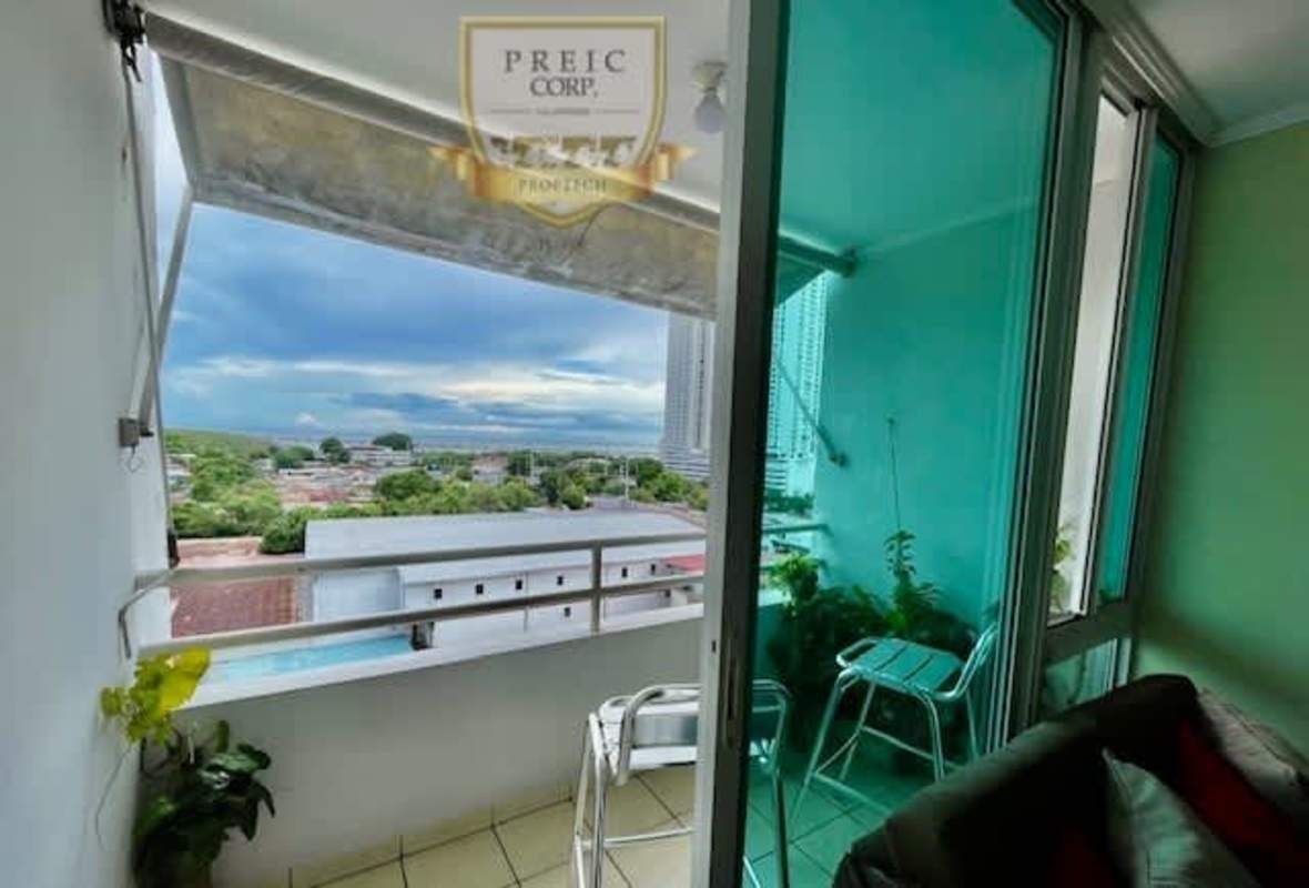 Bedroom with large window city view and built-in closet in PH Parque Lefevre Panama City