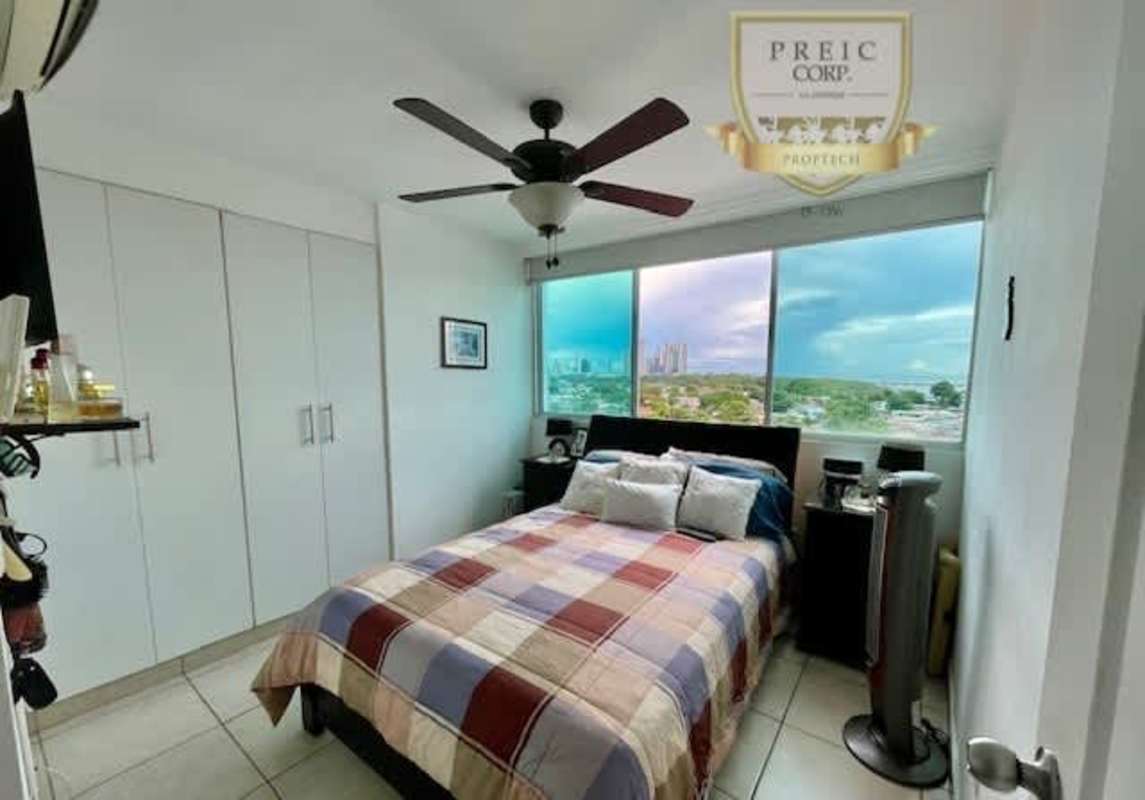 Living room with sliding glass door to balcony PH Parque Lefevre Panama City for sale