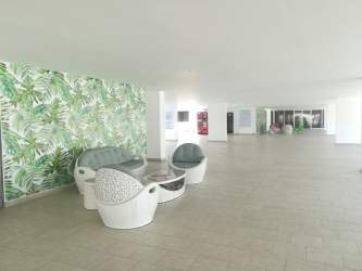 Hallway with elevator, fire extinguisher, art in PH Ocean View Playa Corona Panama