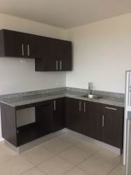 Patio overlooking swimming pool, footbridge, palm trees PH Ocean View Playa Corona Panama