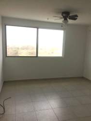 Minimalist bedroom with large window, ceiling fan, natural lighting PH Ocean View Playa Corona Panama