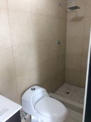 Tropical lobby with wicker chairs and plants PH Ocean View Playa Corona Panama