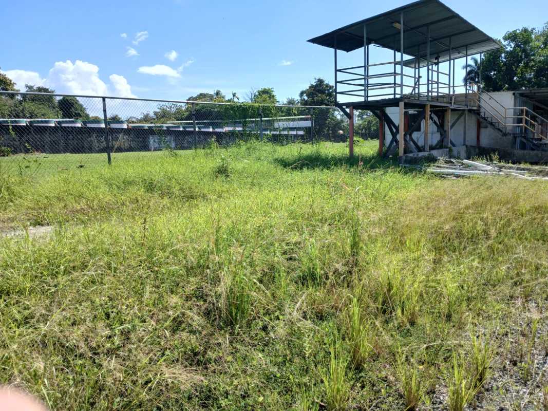 Outdoor fenced commercial property with elevated steel canopy platform along Via Transístmica Panama
