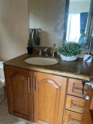 Spacious chef’s kitchen granite countertops wood cabinetry Tucán Country Club Panama