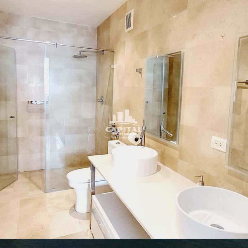 Modern bathroom with double sinks and glass shower in PH Arts & Yoo Avenida Balboa Panama