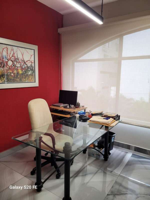 Meeting room with glass-top table and built-in cabinets at PH Plaza San Francisco Panama City