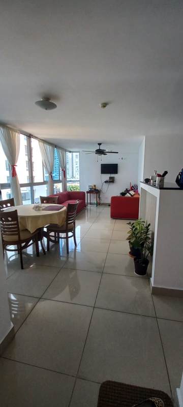 Living and dining area open-concept with large windows PH Carrasquilla Park
