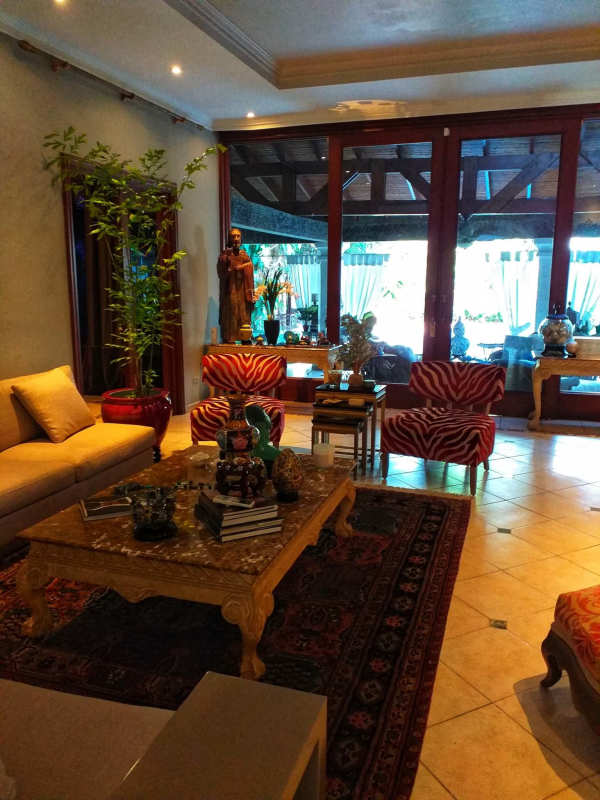 Traditional dining room with ornate chandelier and fine furniture in upscale Panama mansion