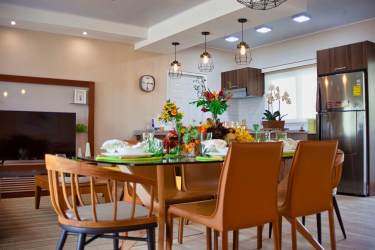 Open plan kitchen dining pendant lights wood decor Villas del María Bejuco Panama