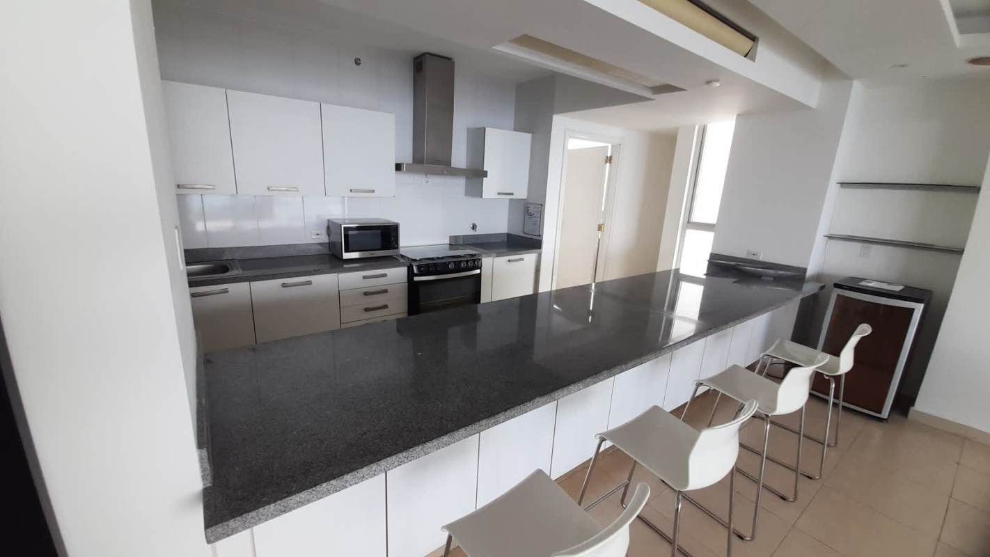 Furnished master bedroom with ocean view window in PH Waters on Balboa Avenue Panama City