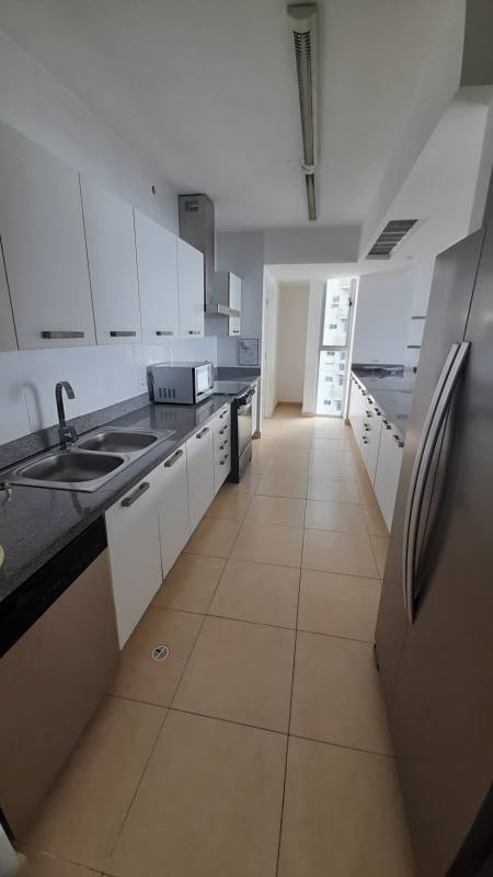 Large balcony with glass railing overlooking Pacific Ocean and Cinta Costera at Waters Panama