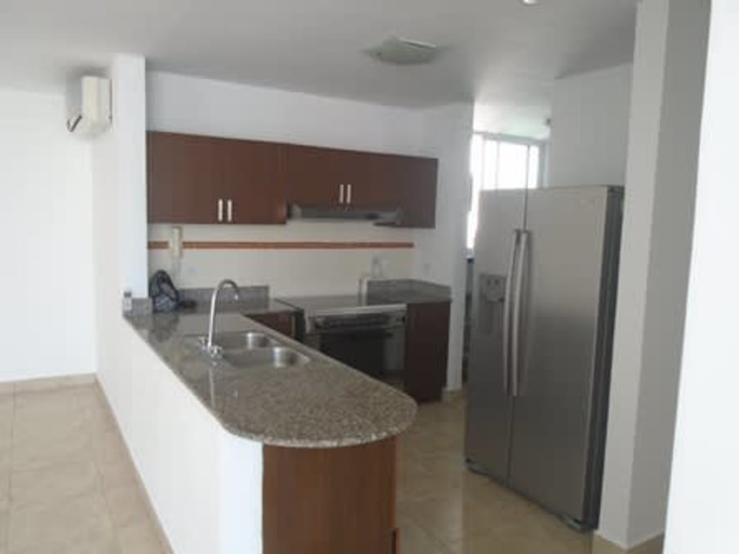 Colorful kids playroom with turf and slides in PH Vista Hermosa Panama