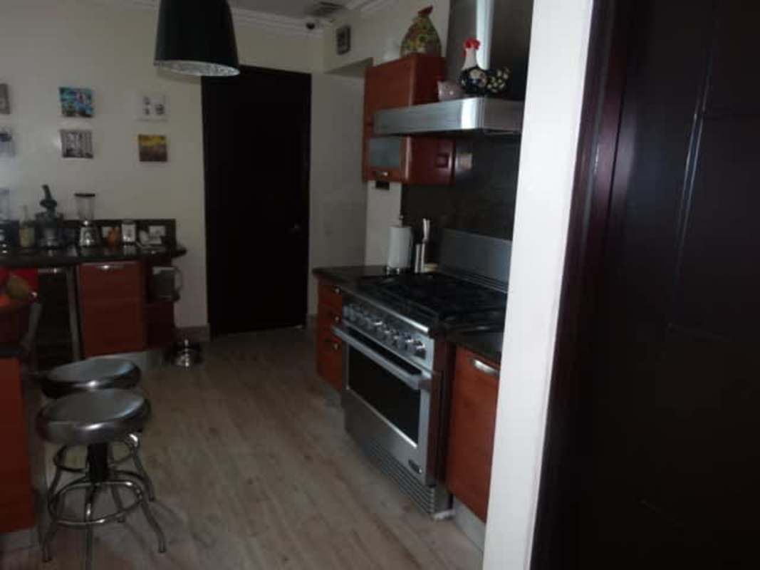 Luxurious bathroom with marble countertops and glass shower enclosure in PH Miramar Panama