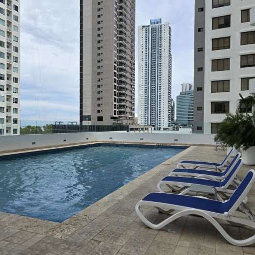 Outdoor swimming pool with lounge chairs PH Sol del Este Costa del Este Panama
