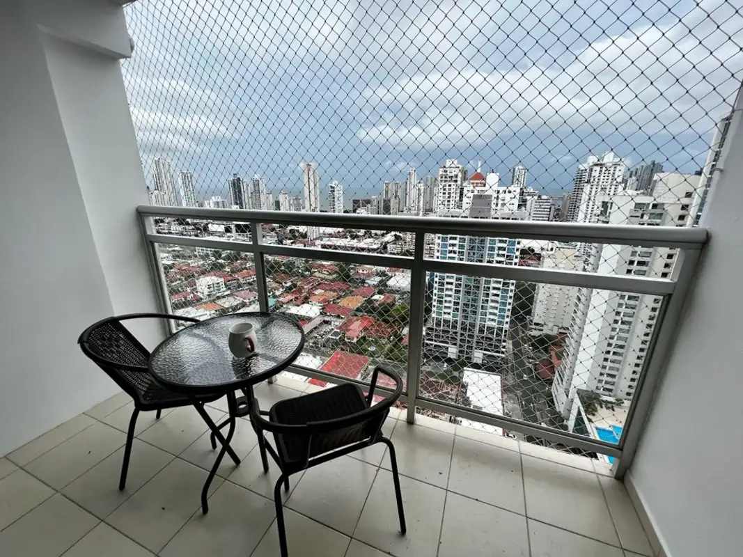 Balcony with safety net glass railing, panoramic city skyline view at PH Latorraca Panama