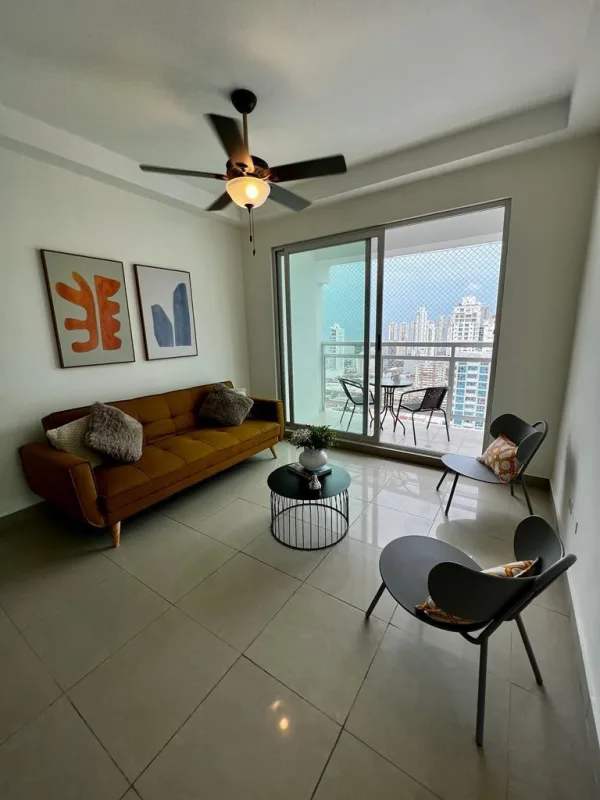 Furnished living dining area with balcony access, tile floors, ceiling fan in PH Latorraca Panama City