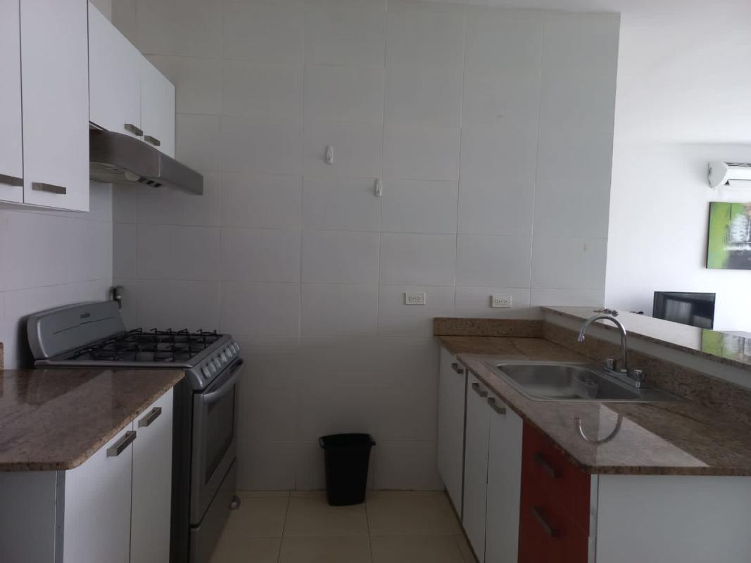 Open kitchen with granite countertops and appliances in Grand Bay Tower Marbella Panama City