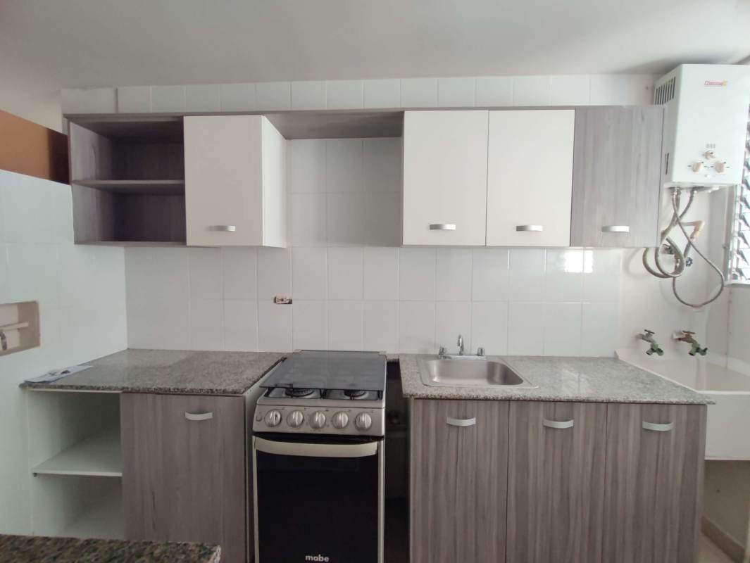 Modern kitchen with granite countertop, gas stove, natural light PH Bella Vista Gardens Panama