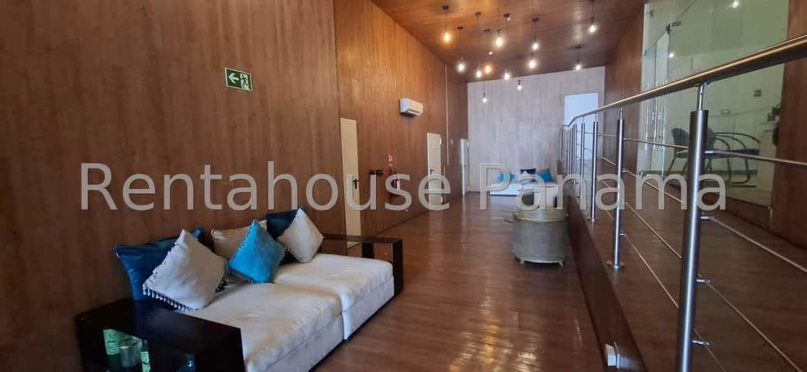 Modern kitchen with appliances and breakfast bar in Quartier del Mar apartment Panama