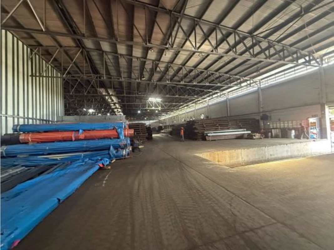 Modern offices with workstations inside industrial warehouse complex in Panama City