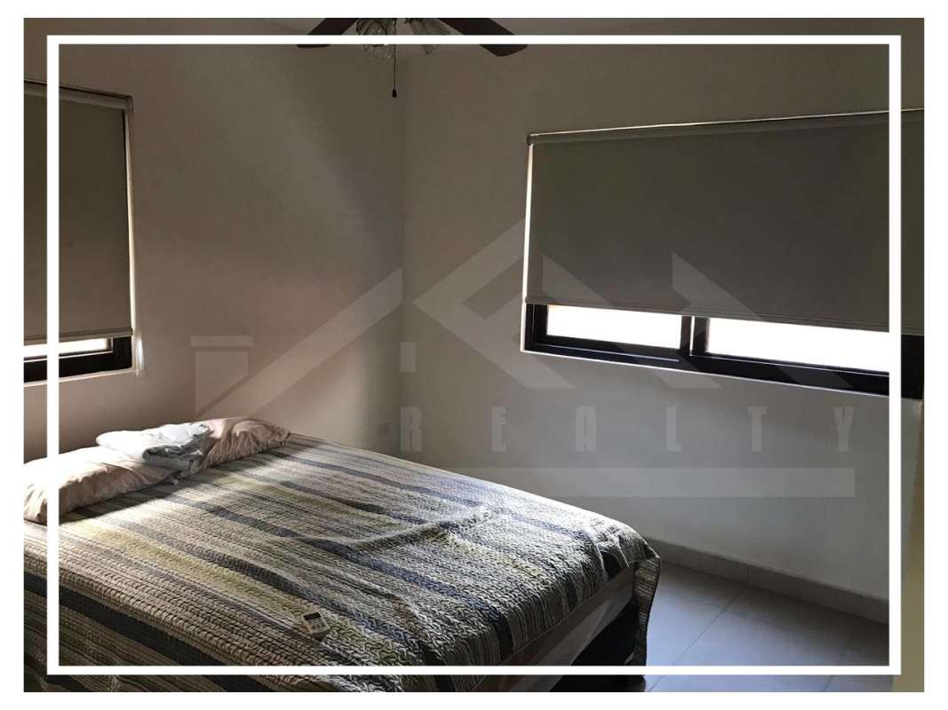 Minimalist bedroom with windows, blinds and neutral decor at PH Embassy Club Clayton Panama City