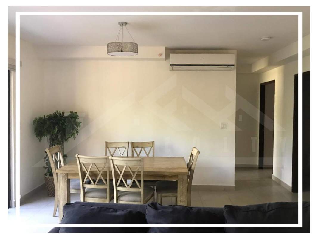 Dining room with wooden table, pendant lamp, AC and garden views Embassy Club Clayton Panama