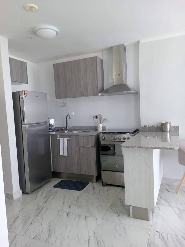 Modern bathroom with glass shower, vanity sink and tile detail PH The Sand Avenida Balboa Panama