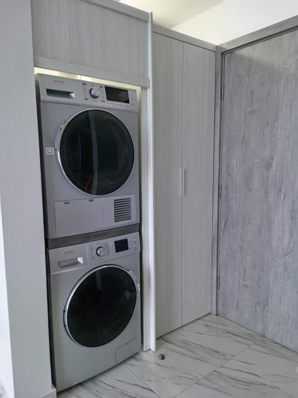 Modern bedroom with large window balcony and Pacific Ocean view at PH The Sand Panama for rent