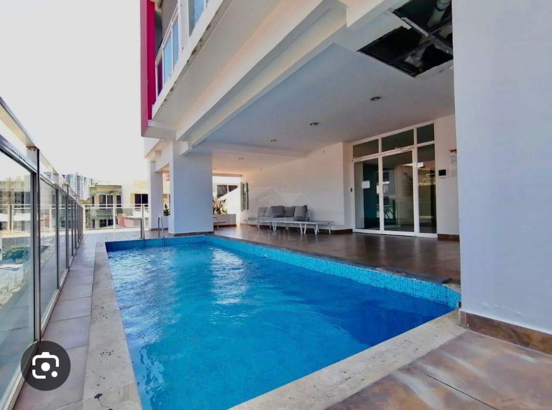 Condominium amenities with covered swimming pool and lounge PH Red Point Panama