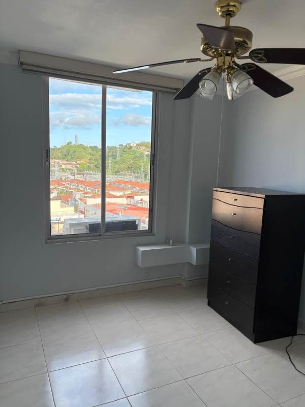 Apartment bathroom with pedestal sink, mirror, and ceramic tiles at PH McGregor Hill Condado del Rey