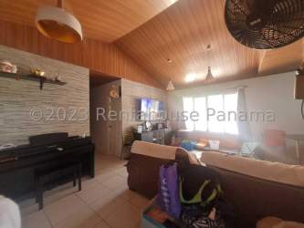 Covered outdoor patio with barbecue and dining area in residential house La Chorrera Panama