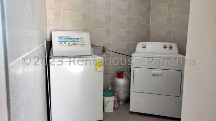Laundry room with appliances, gas cylinder, tiled walls in La Chorrera property