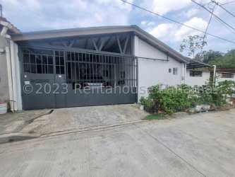 Private swimming pool with garden and tiled patio in residential house La Chorrera Panama