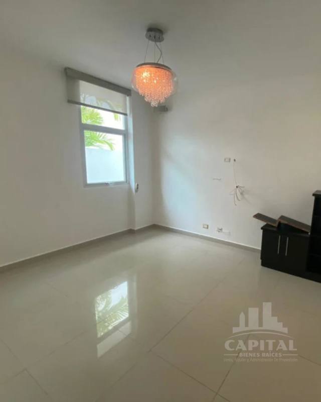 Elegant living room with high ceiling windows tile floors at PH Costa Esmeralda Costa Sur Panama