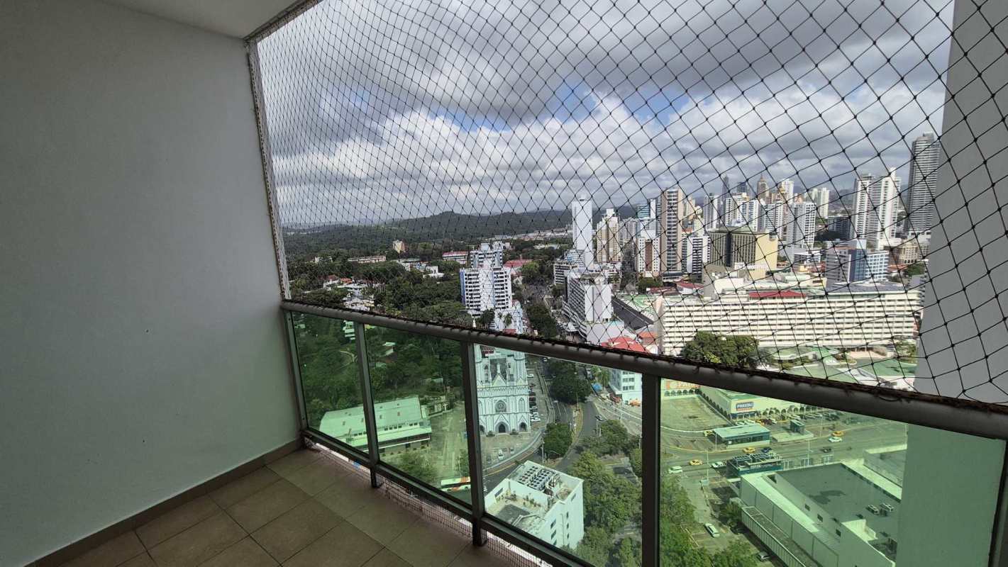Minimalist open plan living dining area, white tile floor in apartment Bella Vista Panama