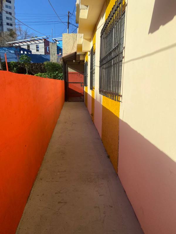 Interior hallway beige tiles doors corridor apartment Parque Lefevre Panama