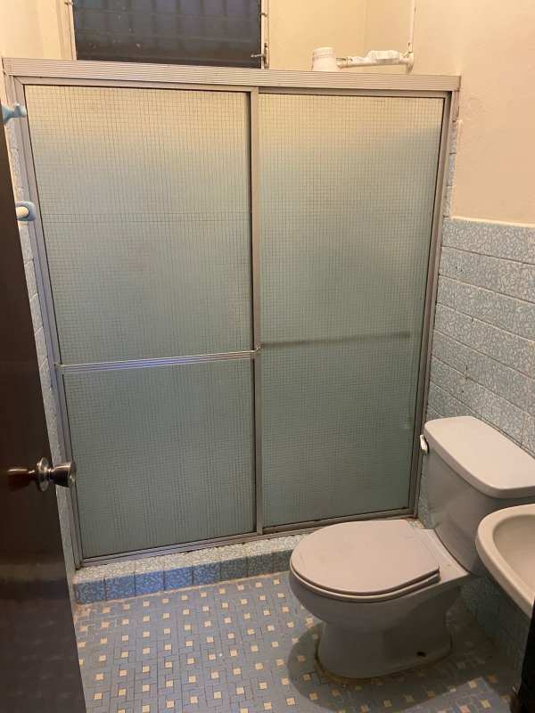 Bathroom blue mosaic tiles frosted shower doors Parque Lefevre Panama apartment