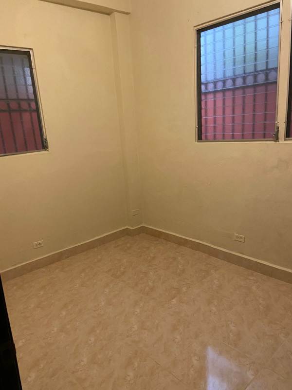 Bedroom with twin barred windows tile floor in Parque Lefevre Panama