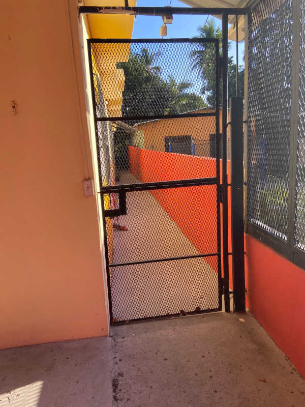 Gated entry walkway exterior apartment complex Parque Lefevre Panama