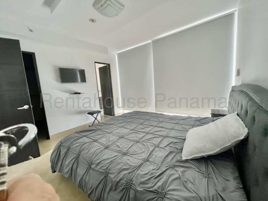 Furnished living and dining area with terrace and skyline view in San Francisco Bay Panama