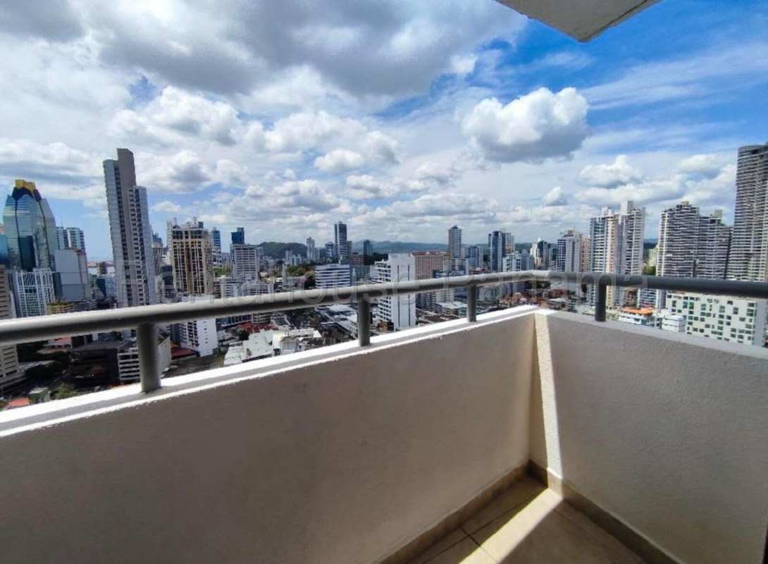 Modern high-rise exterior view of PH Obarrio Tower with balconies and commercial spaces Panama