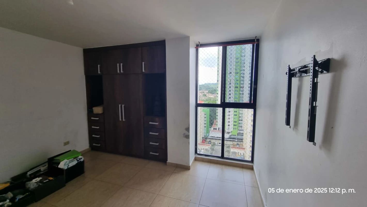 Bedroom with built-in wardrobe, AC unit, large city view window, Condado del Rey Panama apartment for rent