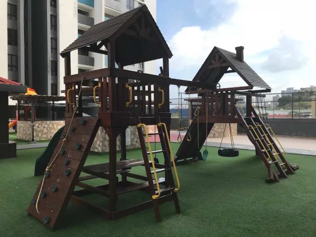 Kids playground with slides swings and artificial grass at PH Condado Country Club Panama