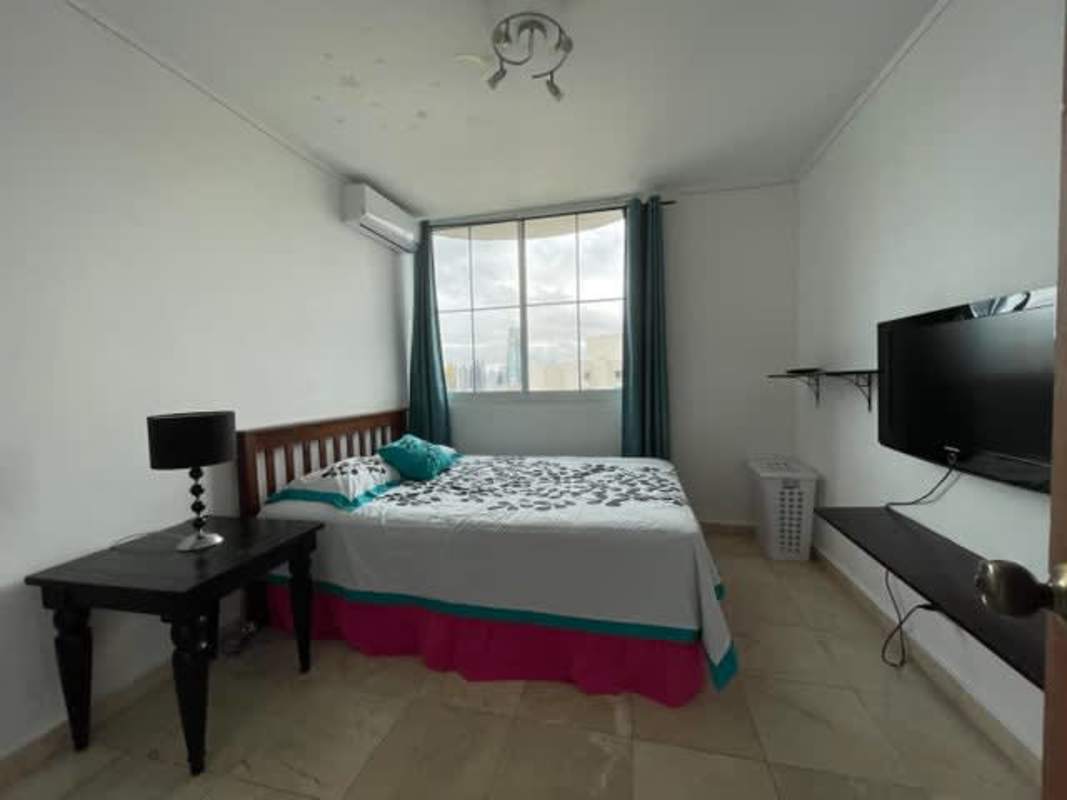 Furnished bedroom with marble flooring and ensuite bath at PH Ocean Park Punta Pacifica Panama