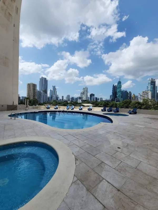 Infinity swimming pool with jacuzzi overlooking Panama City skyline at PH Pacific Wind Punta Pacifica