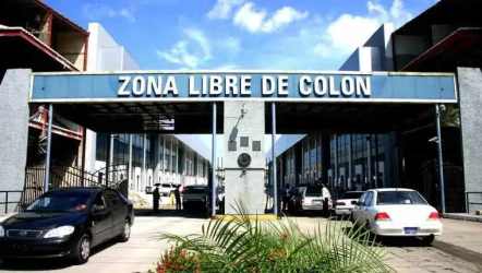 Main entrance gate of Zona Libre Colón with security post and signage