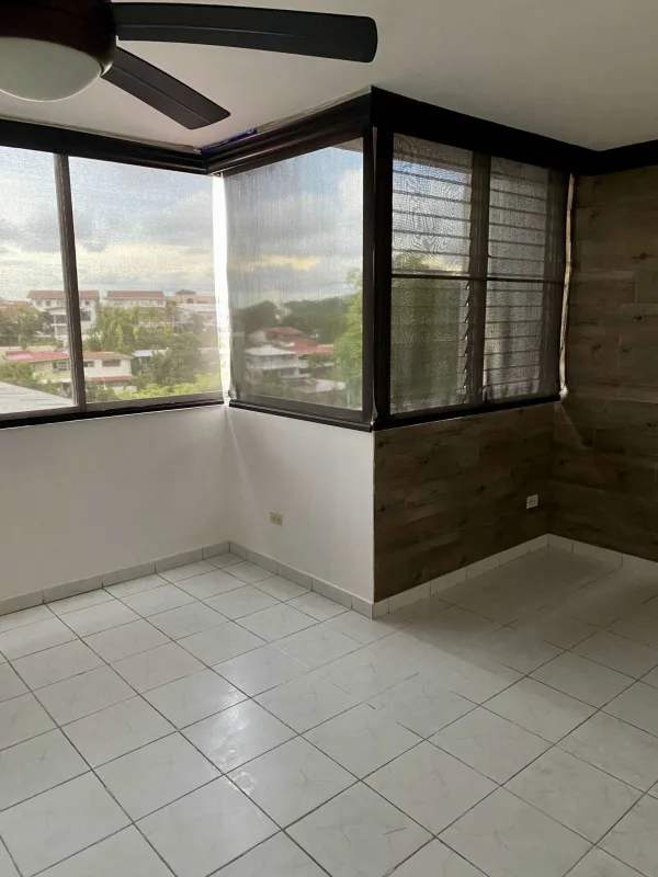 Modern bathroom with glass enclosed shower, white tiles, sink, at Lomas del Dorado Dos Mares Panama 